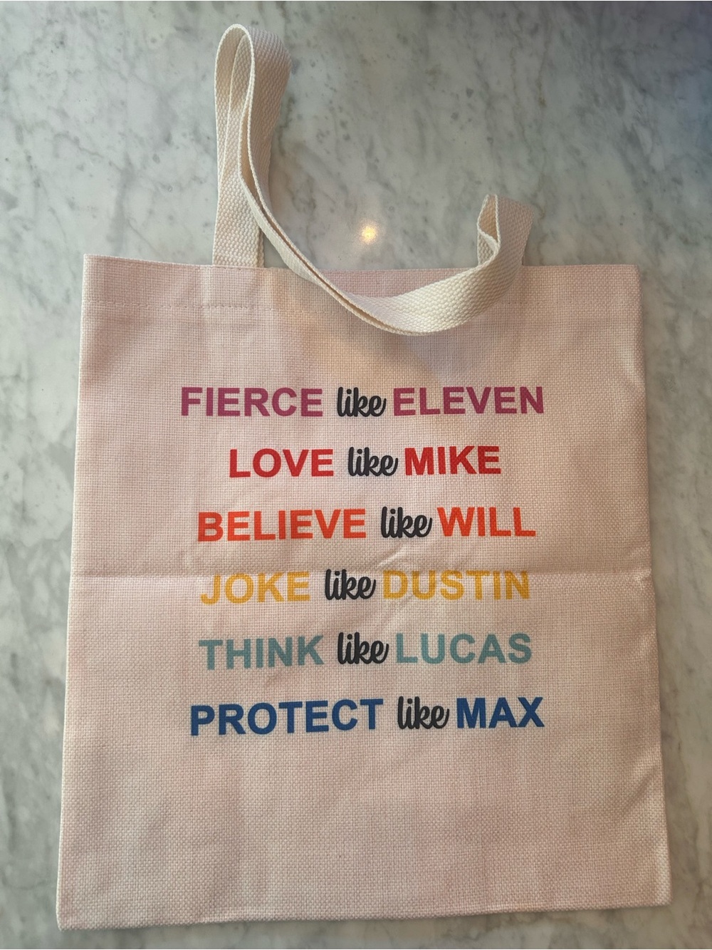 “Stranger Things” new canvas graphic tote Pink Multicolor Text on both sides